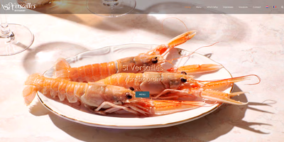 Website Si Versailles: langoustines op een wit bord met gouden rand